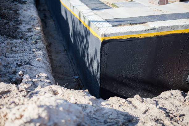 Professional Basement Waterproofing technician working in Garden City, MI